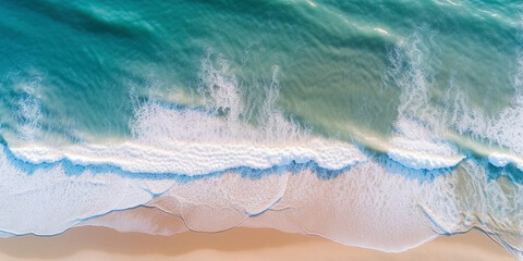 Obraz premium Ocean waves on the beach as a background. Beautiful natural summer vacation holidays background. Aerial top down view of beach and sea with blue water waves