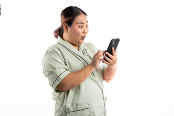 Fototapeta premium Excite and surprise female patient hand holding mobile phone. Happy winner smiling asian women patient on white background. Fat and overweight obese woman