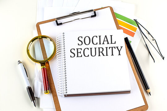 SOCIAL SECURITY text on notebook with clipboard on white background