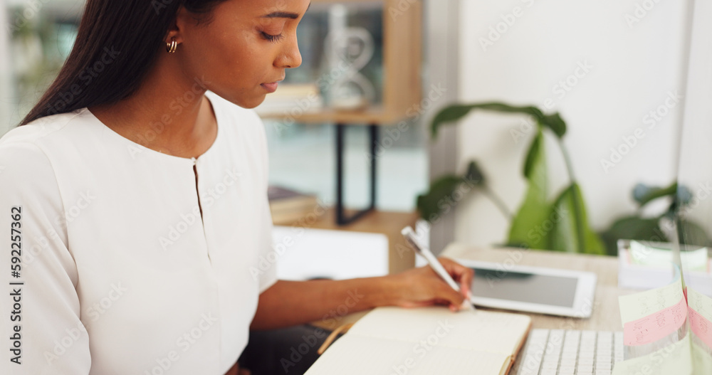 Poster woman at a computer, writing an email or blog at a desk in the office. technology, communication and