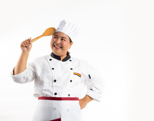 Happy smile Asian obese woman head chef wearing cooking uniform, holding wood ladle kitchen tool standing isolated on white background. Gastronomy expert. Professional cooking, culinary and people