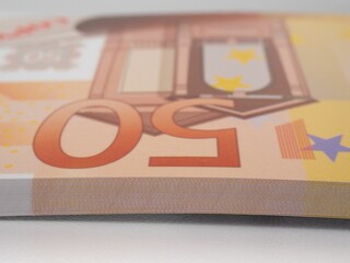 Stacks of 50 euros bills isolated on a white background