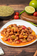 Red kidney beans dish with olive oil on wood floor. Healthy foods. Aegean cuisine delicacies. Close up