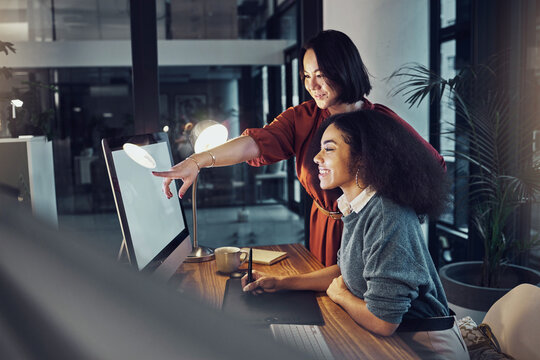 Partnership, computer and women team in the office while working on a corporate project in collaboration. Teamwork, technology and professional female employees planning business report in workplace.