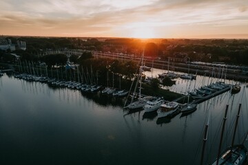 Aerial view of sailing boats moored in the lake in Enkhuizen, Netherlands at sunset