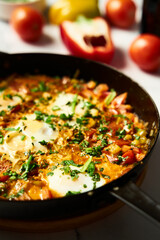 Moroccan Shakshuka. Mediterranean Goodness Shakshuka with Vibrant Colors and Bold Flavors. Breakfast dish with eggs peppers and tomatoes plus spices