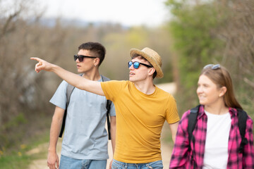 Young group of friends walking in nature
