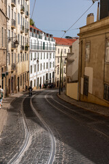 Naklejka na ściany i meble Portugal Street with buildings and tramway rails