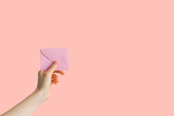 hand holding envelope with message