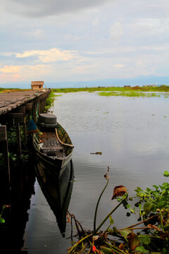 a boat on a marsh lake