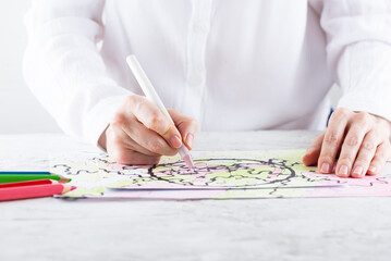 Woman drawing neurographics, psychological technique.