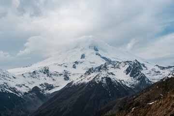 View of the valley and Mount Elbrus in the cloud