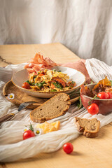 pasta salad with bread and meat chips
