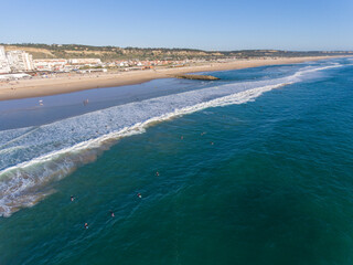 Caparica Beach Aerial Photos of surfist in sea, Portugal