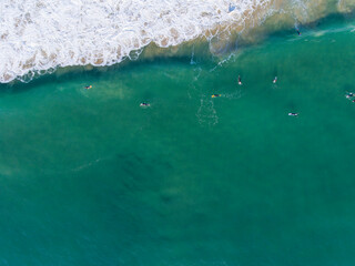 Caparica Beach Aerial Photos of surfist in sea, Portugal
