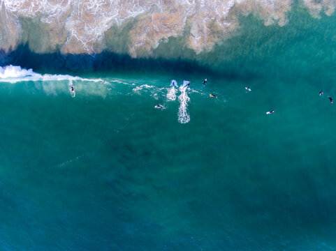 Caparica Beach Aerial Photos of surfist in sea, Portugal