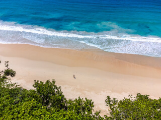 Man walking alone at the beach in Grande Anse