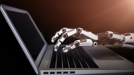 the robot's hand works on the computer keyboard