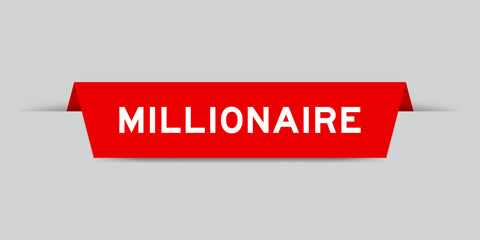 Red color inserted label with word millionaire on gray background