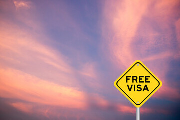 Yellow transportation sign with word free visa on violet color sky background