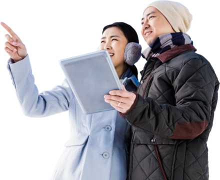 Couple looking away while holding digital tablet - Powered by Adobe