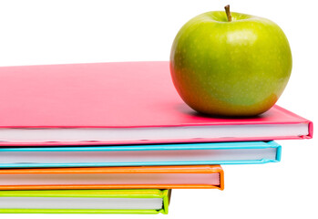 Green apple on notebooks