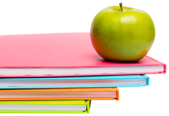 Green apple on notebooks