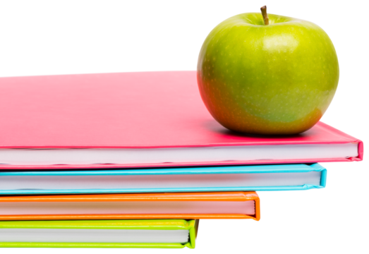 Green apple on notebooks