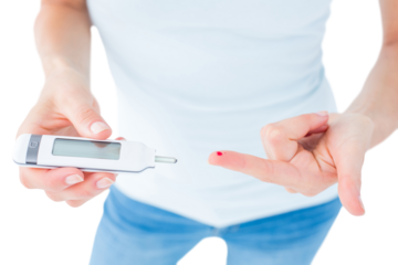 Woman testing her blood glucose level 