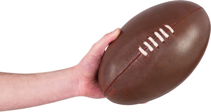 Rugby player handing a rugby ball