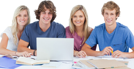 Obraz premium A group of students with a laptop look into the camera