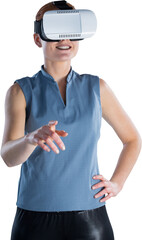 Smiling businesswoman with hand on hip gesturing while wearing virtual reality glasses