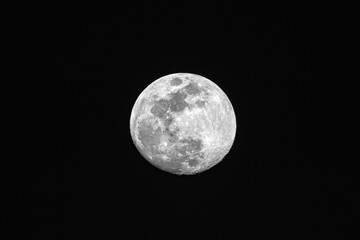 Full moon on the night sky, closeup, can be used as natural background.