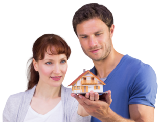 Couple holding a model house