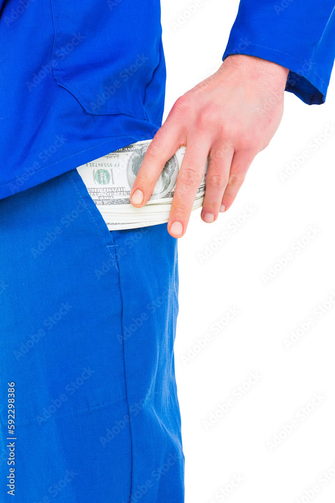 Wall mural Handyman putting money in his pocket