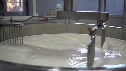 Cooking milk in a steel stainless tank for cheese production