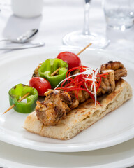 Chicken skewers - grilled meat with  vegetables on white background. Chicken kebab skewers.