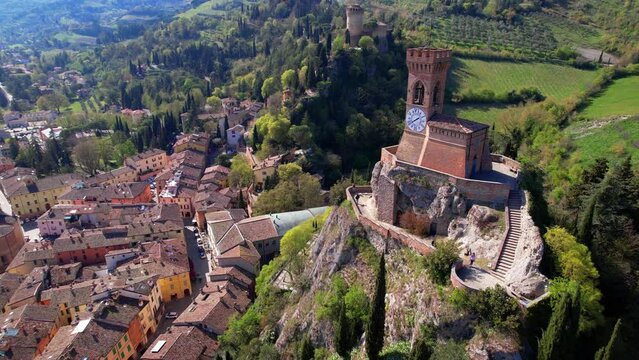 one of the most beautiful medieval villages of Italy - Brisighella in Ravenna province  in Emilia-Romagna, Aerial drone overflight view of the castle and clock tower