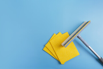 Set for cleaning windows on blue background