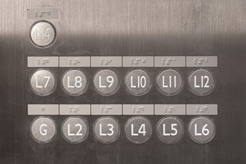 An elevator level button panel with braille code and 3d spot for blindness person. Sign and symbol...