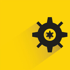 gear with shadow on yellow background