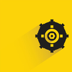 gear with shadow on yellow background