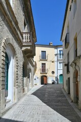 A narrow street among the old houses of Larino, a medieval town in the province of Campobasso in Italy.
