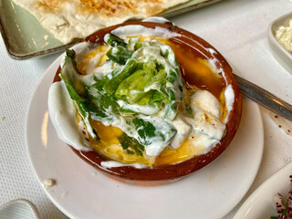 Freshly harvested cibes grass with yogurt and olive oil.