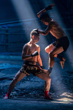 Martial arts of Muay Thai with Light and Shadow background,Thai Boxing, This photo can use for muay thai, sport thai, combat concept. Asian kickboxing, Muay Thai kickboxing kickboxer boxing men.