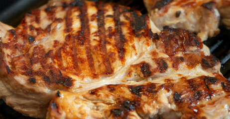 Grilled pork steak background. Close up