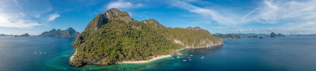 Fototapeta premium Drone panorama of the paradisiacal Seven Commandos beach near El Nido on the Philippine island of Palawan
