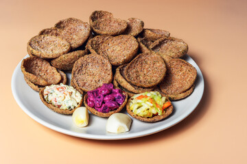Rye bread toast on a plate on an orange background