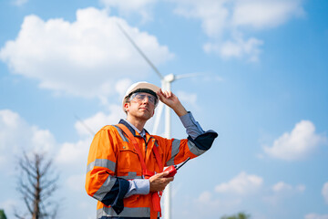 Wind turbine service engineer maintenance and plan for inspection at construction site, renewable electricity generator.