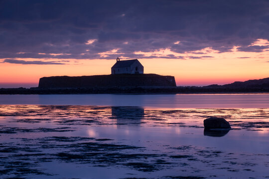 St. Cwyfan's Church (Church in the Sea) on the island of Cribinau at sunset, near Aberffraw, Anglesey, North Wales